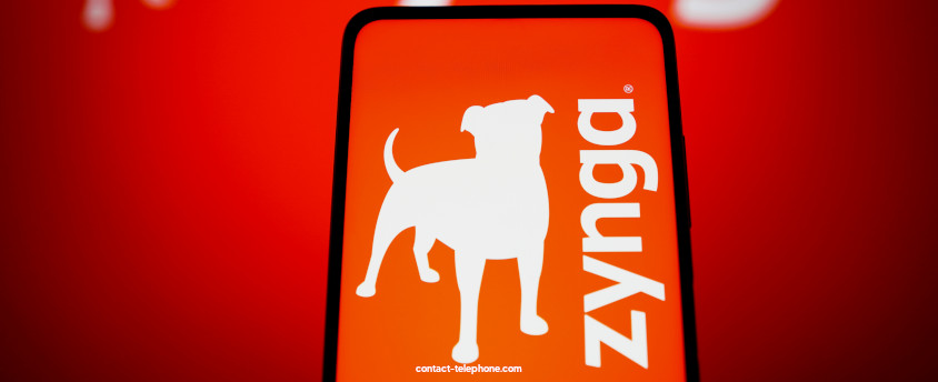 Téléphone portable affichant le logo Zynga sur un fond rouge.